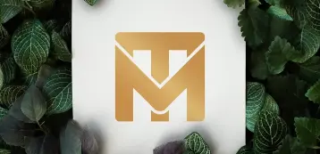 Mockup showing the new TM Maintenance Services icon only on a sign surrounded by leaves