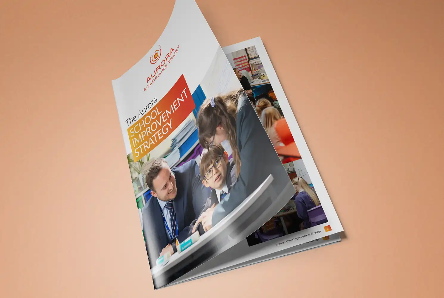 Mockup showing cover of the Aurora School Improvement brochure